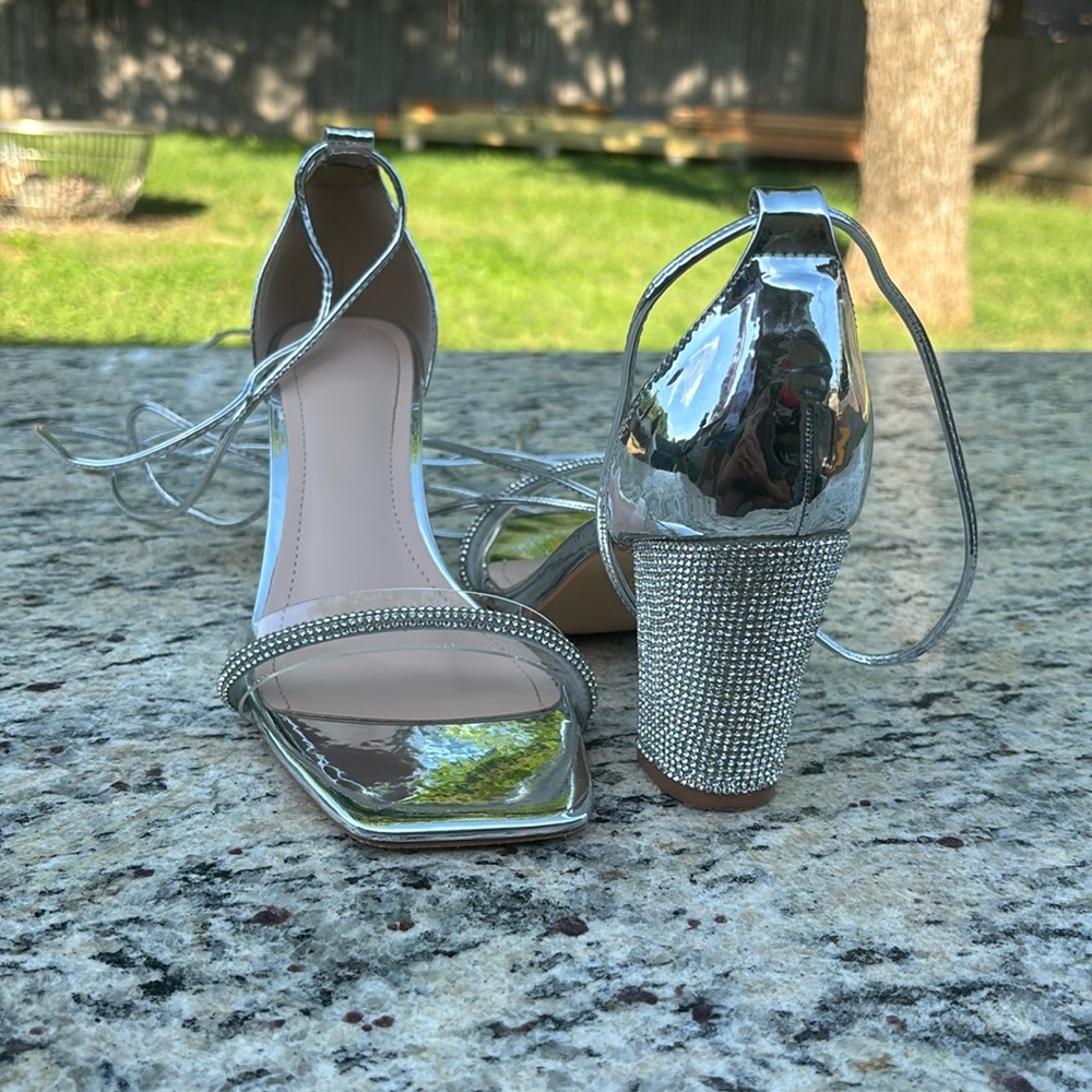 Size 8.5 silver with rhinestone wedge heel. Only worn one time $15